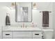 Stylish bathroom featuring marble countertops, gold fixtures, and a large mirror at 3530 E Glenrosa Ave, Phoenix, AZ 85018