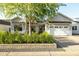 Charming home with white garage door, landscaped front yard, and craftsman-style architectural details at 3530 E Glenrosa Ave, Phoenix, AZ 85018