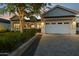 Inviting exterior view of home showcasing garage, landscaping, and warm lighting at dusk at 3530 E Glenrosa Ave, Phoenix, AZ 85018