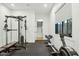 Well-equipped home gym with weight rack, rowing machine, and access to a storage closet at 3530 E Glenrosa Ave, Phoenix, AZ 85018