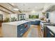 Spacious kitchen featuring blue cabinets, white countertops, large island, and stainless steel appliances at 3530 E Glenrosa Ave, Phoenix, AZ 85018