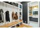 Practical mudroom with built-in storage, bench seating, and access to the laundry room at 3530 E Glenrosa Ave, Phoenix, AZ 85018