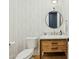 Cozy powder room featuring a stylish vanity, marble countertop, and modern fixtures at 3530 E Glenrosa Ave, Phoenix, AZ 85018