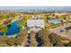 Bird's eye view of the Clubhouse showing nearby pond, swimming pool, clubhouse, and surrounding green landscaping at 3890 S Star Canyon Dr, Gilbert, AZ 85297