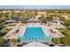 A detailed overhead shot highlighting the clear blue community pool, lounge areas, and recreational facilities at 3890 S Star Canyon Dr, Gilbert, AZ 85297