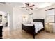 Bright bedroom with tile floors, ceiling fan, and comfortable furnishings at 3890 S Star Canyon Dr, Gilbert, AZ 85297