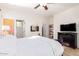 Bedroom featuring light walls, tile floors, and ceiling fan at 3890 S Star Canyon Dr, Gilbert, AZ 85297