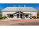 Exterior shot of a clubhouse featuring a light brick facade, covered entryway, and clearly marked fire lane at 3890 S Star Canyon Dr, Gilbert, AZ 85297