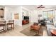 Bright living room featuring neutral tile, modern furniture, and a ceiling fan at 3890 S Star Canyon Dr, Gilbert, AZ 85297