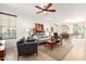 Open-concept living room with lots of light, tile floors, and view into the dining area at 3890 S Star Canyon Dr, Gilbert, AZ 85297