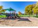 Well-maintained community playground featuring various play structures, mature trees, and open green spaces at 3890 S Star Canyon Dr, Gilbert, AZ 85297