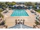 A great overhead view of the pristine community pool and lounge area with shade features and an outdoor grill at 3890 S Star Canyon Dr, Gilbert, AZ 85297