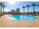 A panoramic shot of the sparkling community pool area, highlighting its clear blue water and inviting lounge spaces at 3890 S Star Canyon Dr, Gilbert, AZ 85297