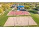 A vibrant aerial view showcasing community recreational facilities, including basketball and volleyball courts at 3890 S Star Canyon Dr, Gilbert, AZ 85297