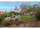 Expansive backyard offers a pool, outdoor seating, landscaping, and desert views at 42038 N Moss Springs Rd, Anthem, AZ 85086