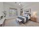 Bedroom featuring neutral tones, carpet and windows with plantation shutters and ensuite access at 42038 N Moss Springs Rd, Anthem, AZ 85086