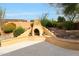 Outdoor fireplace area with bench seating and beautiful desert landscape at 42038 N Moss Springs Rd, Anthem, AZ 85086