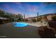 Backyard pool and outdoor fireplace, perfect for evening relaxation and entertainment at 42038 N Moss Springs Rd, Anthem, AZ 85086