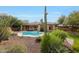 Inviting pool with a large patio and desert landscaping is perfect for outdoor relaxation at 42038 N Moss Springs Rd, Anthem, AZ 85086