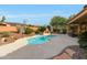 Backyard pool features a pebble surface, landscaping, and seating nearby at 42038 N Moss Springs Rd, Anthem, AZ 85086