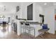 Well-lit kitchen area features a breakfast bar, stainless steel appliances, and a view into the dining room at 4718 E Mossman Rd, Phoenix, AZ 85050