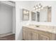 Bathroom featuring a vanity with a marble countertop and decorative mirrors at 5735 E Mcdowell E Rd # 213, Mesa, AZ 85215