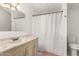 Bathroom featuring a vanity with a marble countertop and a tub with a shower curtain at 5735 E Mcdowell E Rd # 213, Mesa, AZ 85215