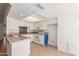 Bright kitchen with white cabinets and tile countertops offers ample storage and workspace at 6534 S Marilyn Ann Dr, Tempe, AZ 85283