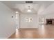 Spacious living room featuring neutral tile floors, and a cozy fireplace at 6534 S Marilyn Ann Dr, Tempe, AZ 85283