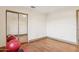 This exercise room has hardwood floors and a mirrored closet door, and a glimpse of fitness equipment at 6915 E Gary Rd, Scottsdale, AZ 85254