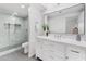 Stylish bathroom showcasing modern shower, white vanity, tile and framed mirror at 7209 E Mcdonald Dr # 51, Scottsdale, AZ 85250