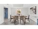 Formal dining room features a large table with seating for six and gray tile flooring at 7209 E Mcdonald Dr # 51, Scottsdale, AZ 85250