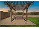 Backyard patio with pergola, ideal for outdoor relaxation and entertaining with mountain views at 7576 W Fetlock Trl, Peoria, AZ 85383