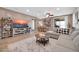 Cozy living room featuring tile floors, neutral colors, and access to the backyard through a sliding glass door at 7576 W Fetlock Trl, Peoria, AZ 85383