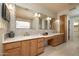 Luxurious bathroom features dual vanities, sleek cabinetry, and modern fixtures at 8233 E Foothill Cir, Scottsdale, AZ 85255