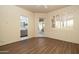 Spacious bedroom featuring wood-look tile flooring and access to an en-suite bathroom at 8233 E Foothill Cir, Scottsdale, AZ 85255