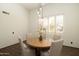 Dining room with natural light, wood floors, and a round table at 8233 E Foothill Cir, Scottsdale, AZ 85255