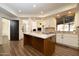 Open kitchen with a center island, granite counters, and tile backsplash at 8233 E Foothill Cir, Scottsdale, AZ 85255