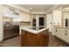 Modern kitchen featuring stainless steel appliances, granite countertops, and custom cabinetry at 8233 E Foothill Cir, Scottsdale, AZ 85255