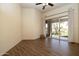 Bright living room features wood-look tile flooring and access to a patio through sliding glass doors at 8233 E Foothill Cir, Scottsdale, AZ 85255