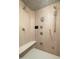 Luxurious tiled shower featuring multiple shower heads and a built-in seat at 8233 E Foothill Cir, Scottsdale, AZ 85255