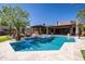 Stunning pool with travertine tile surround, perfect for relaxation and enjoying the outdoor living space at 8233 E Foothill Cir, Scottsdale, AZ 85255