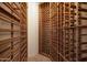 Large wine cellar with plenty of storage racks for wine bottles at 8233 E Foothill Cir, Scottsdale, AZ 85255