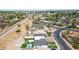 Aerial view of the property, showcasing the home's layout, backyard with pool, and the surrounding neighborhood at 92 N Palm St, Gilbert, AZ 85234