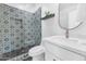 Bathroom featuring patterned tile in the shower and on the floor, plus a vanity and modern fixtures at 92 N Palm St, Gilbert, AZ 85234