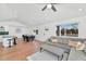 Bright living room with hardwood floors and a seamless transition to the dining and kitchen areas at 92 N Palm St, Gilbert, AZ 85234