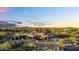 Expansive aerial view of a luxury desert home, highlighting its modern design and scenic desert location at 10354 E Celestial Dr, Scottsdale, AZ 85262