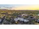 Stunning aerial shot of a modern home, landscaped and set in a tranquil desert community with picturesque mountain views at 10354 E Celestial Dr, Scottsdale, AZ 85262