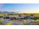 Aerial view of a luxury desert home with a pool, stunning desert landscaping, and mountain views at 10354 E Celestial Dr, Scottsdale, AZ 85262