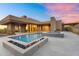 Contemporary desert home featuring a pool, fire feature, and spacious patio at 10354 E Celestial Dr, Scottsdale, AZ 85262